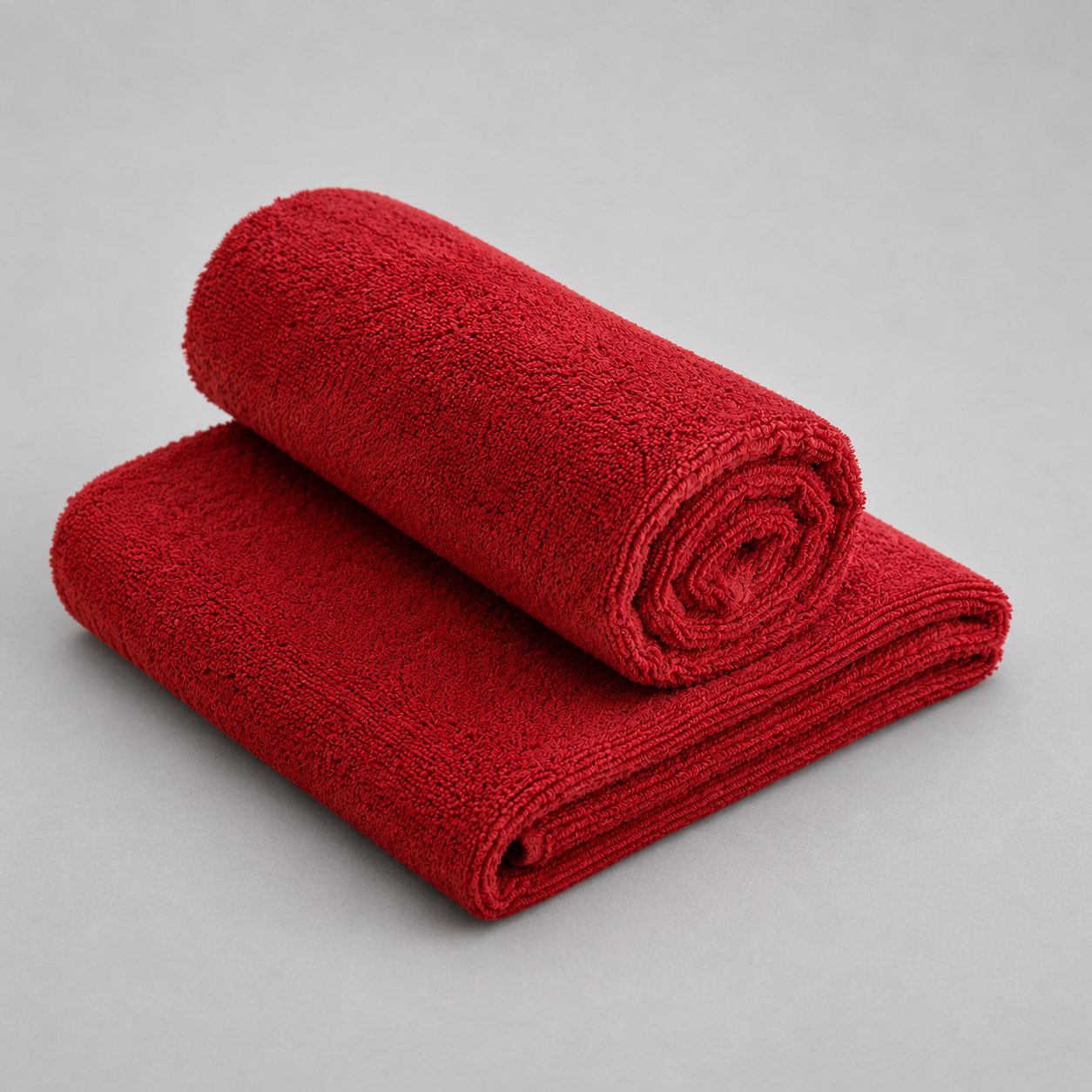 Rød frotté i metermål i blød bomuld og polyester, Øko-tex certificeret og velegnet til tekstiler.
